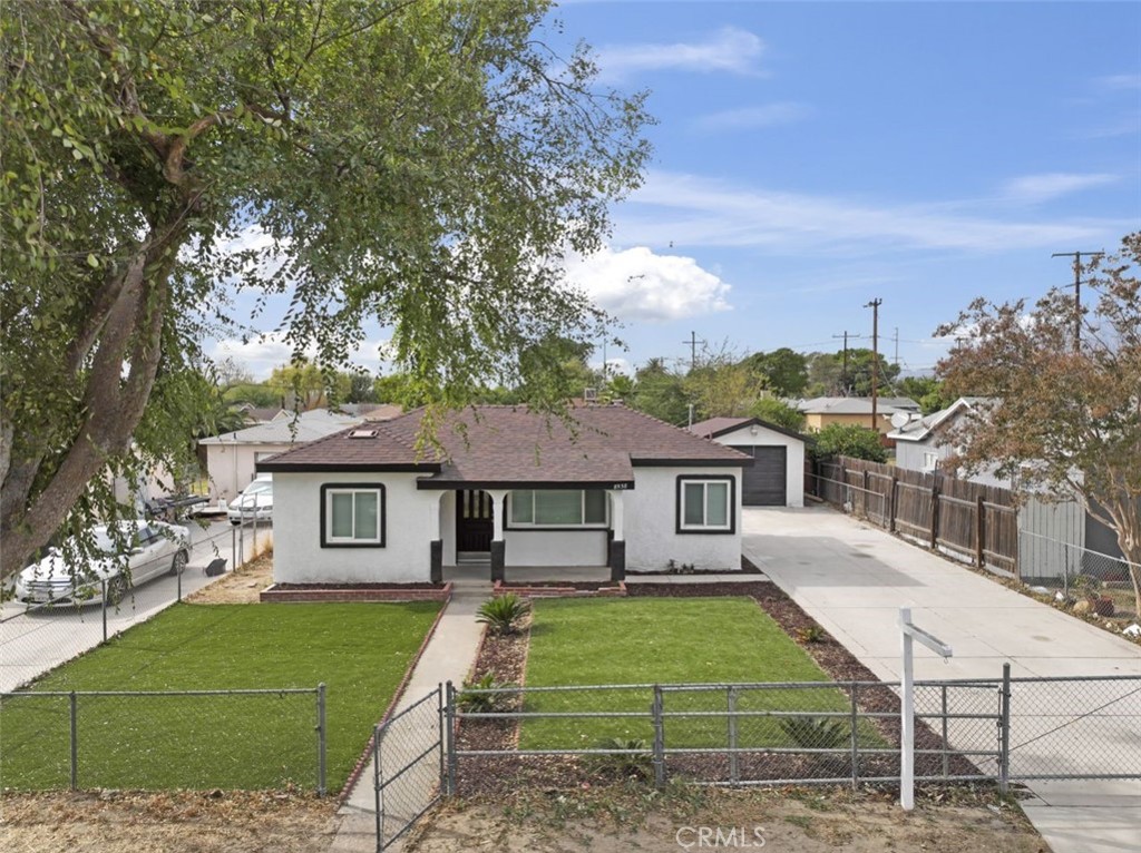 8538 Williams Road Fontana, CA 92335 - Photo 1 of 1 a front view of a house with garden