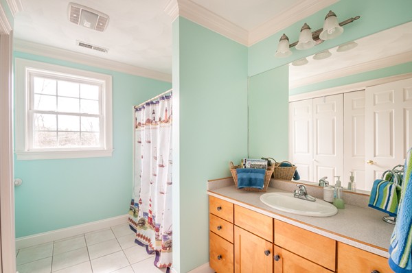 100 Eastgate Road Tewksbury, MA 01876 - Photo 24 of 30 a bathroom with a granite countertop sink and a mirror