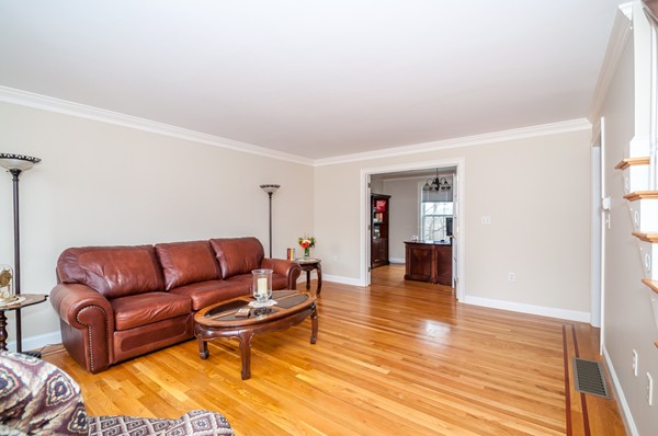 100 Eastgate Road Tewksbury, MA 01876 - Photo 4 of 30 a living room with furniture and a wooden floor