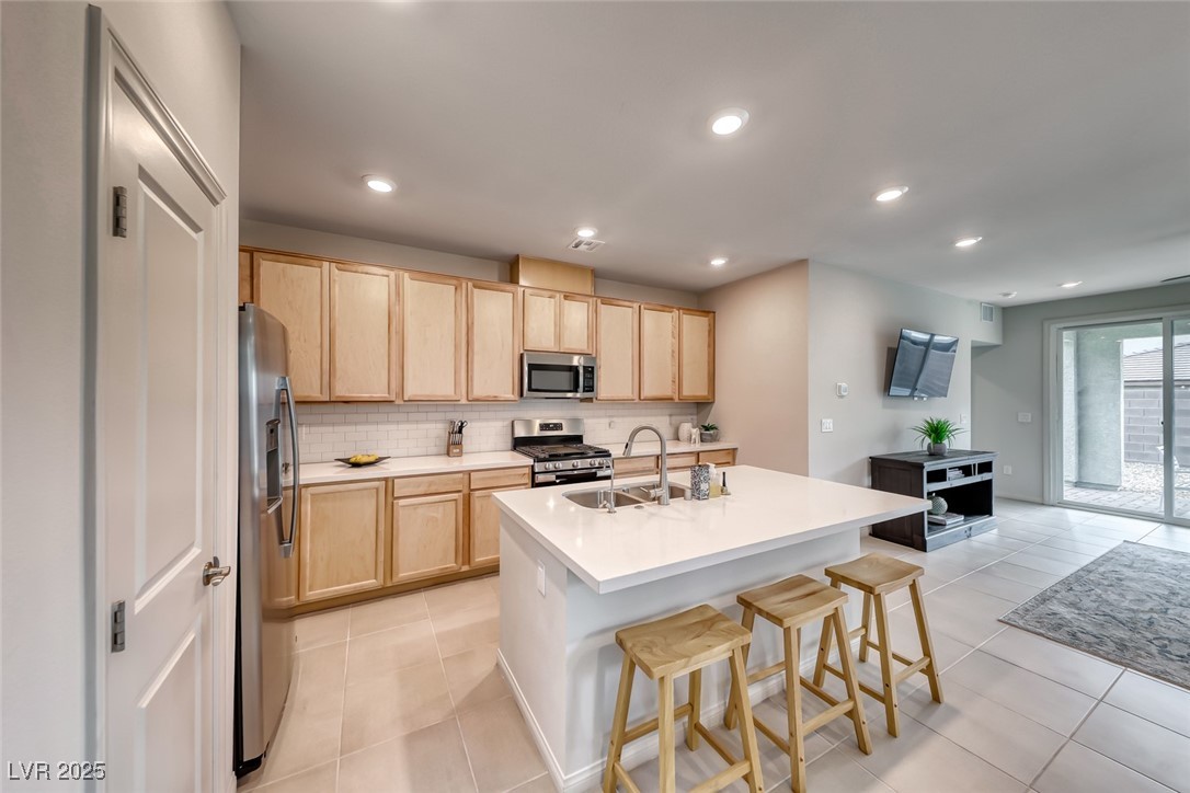 Kitchen with quartz countertops and large island