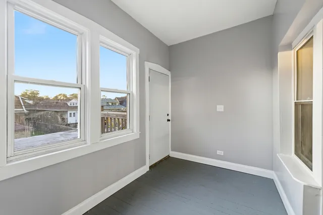 an empty room with windows