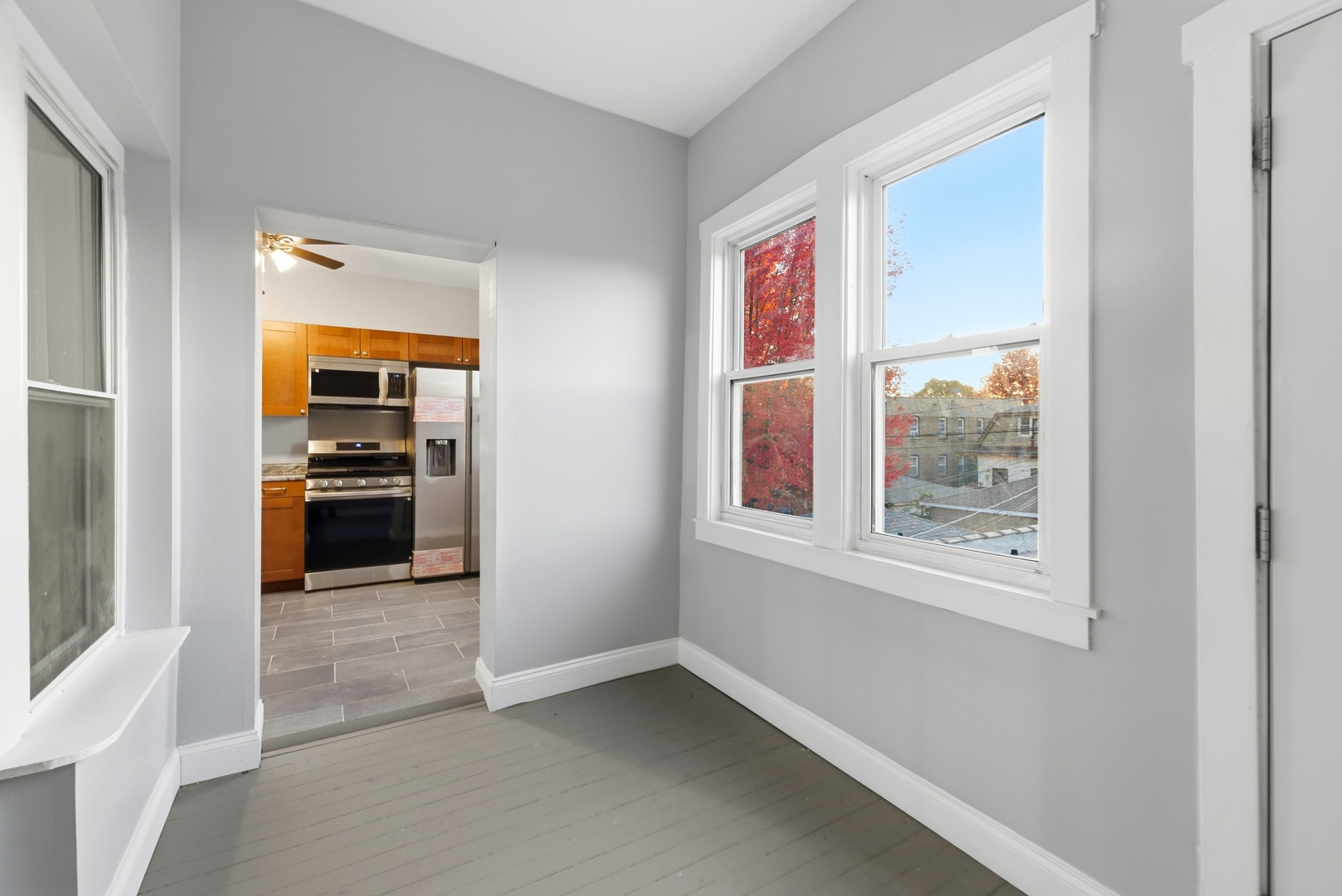 8344 South Marshfield Avenue Chicago, IL 60620 - Photo 14 of 35 a view of a hallway with wooden floor and a living room