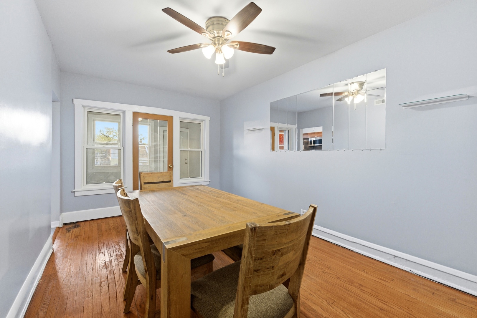 8344 South Marshfield Avenue Chicago, IL 60620 - Photo 15 of 35 a view of a dining room with a table and chairs