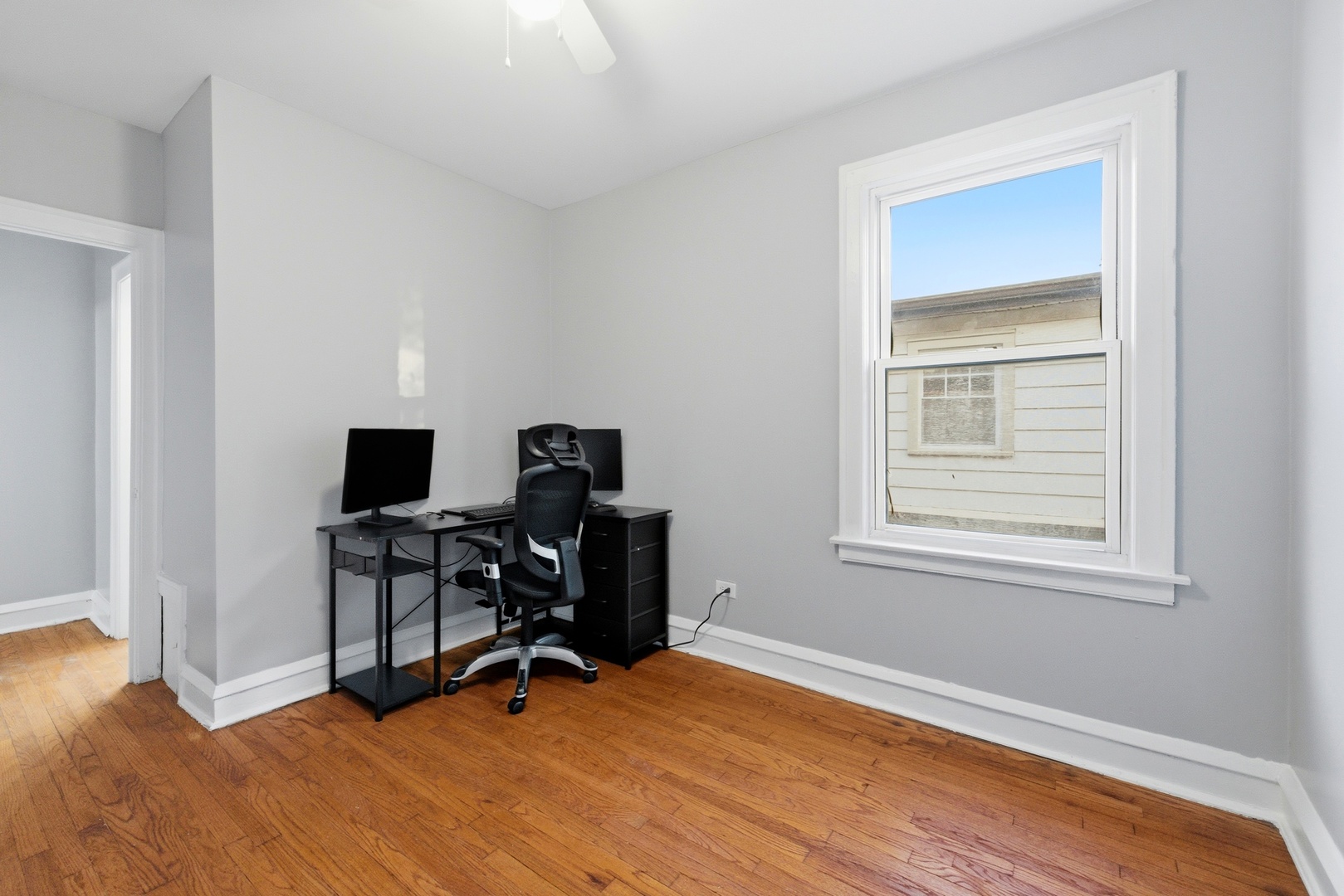 8344 South Marshfield Avenue Chicago, IL 60620 - Photo 23 of 35 a view of workspace with wooden floor and windows