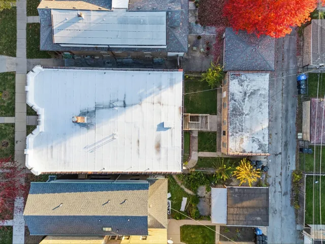 a view of multiple houses with a yard