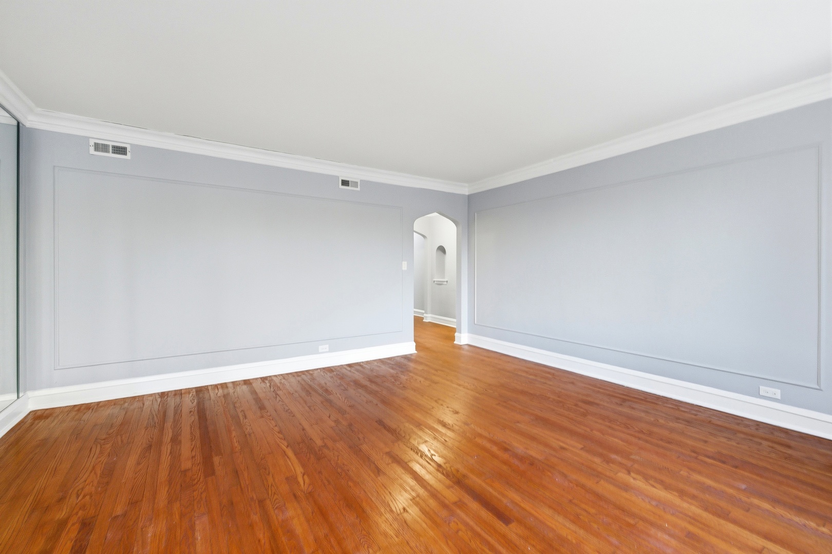 8344 South Marshfield Avenue Chicago, IL 60620 - Photo 5 of 35 a view of an empty room with wooden floor and a window