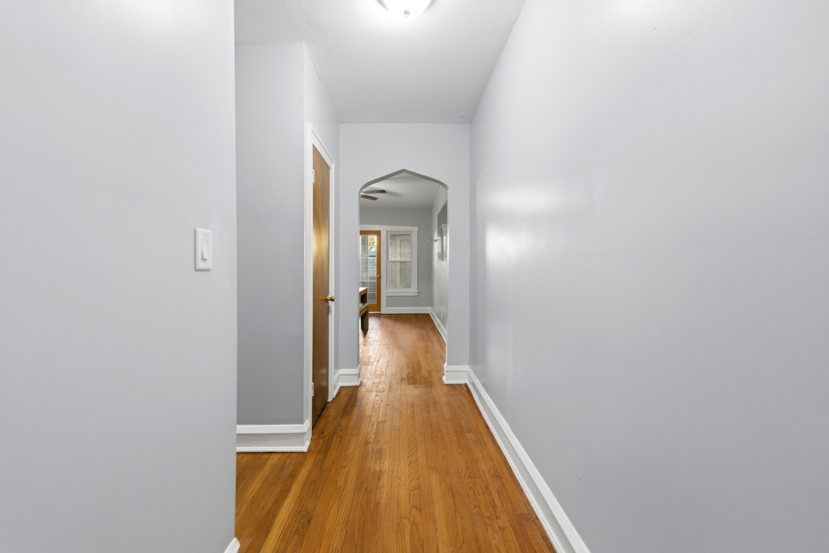 8344 South Marshfield Avenue Chicago, IL 60620 - Photo 8 of 35 a view of a hallway with wooden floor