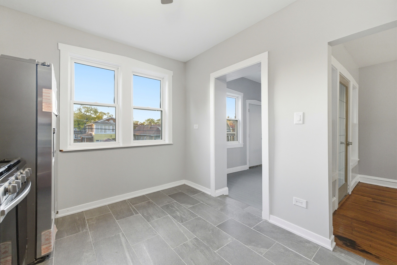 8344 South Marshfield Avenue Chicago, IL 60620 - Photo 10 of 35 a view of livingroom with hardwood floor and window