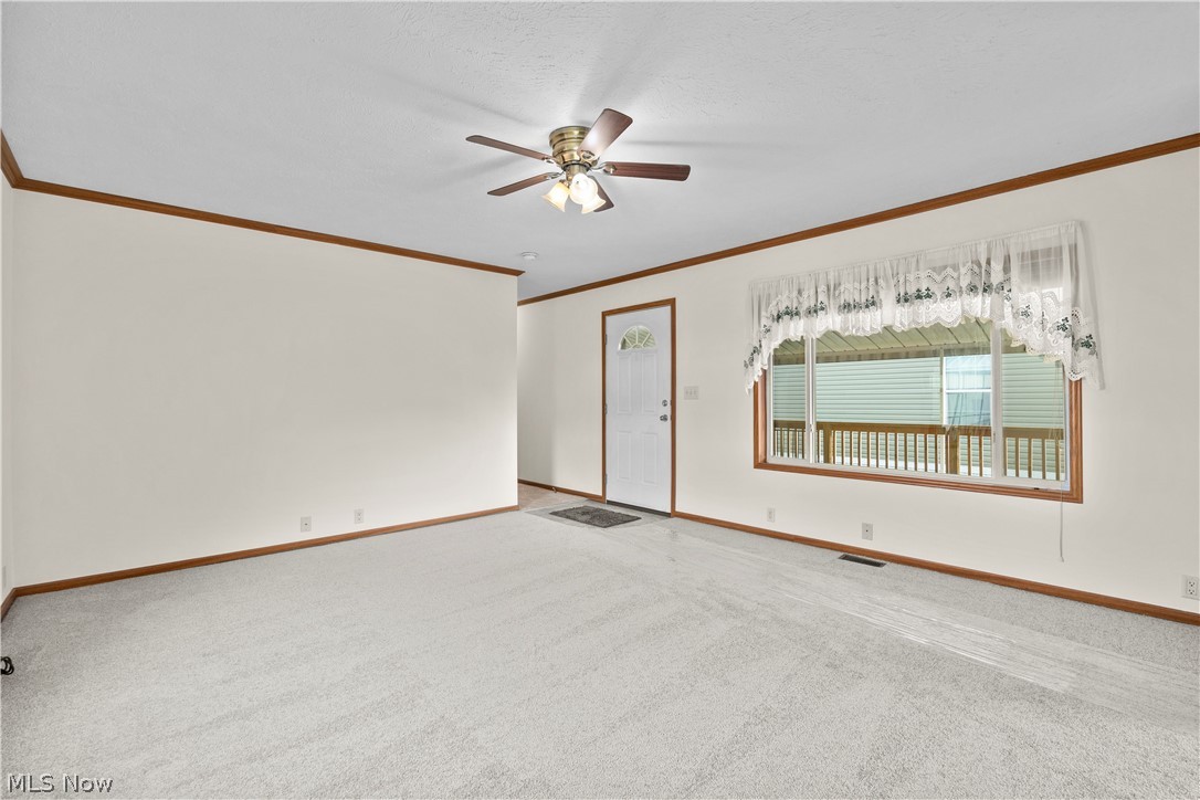 35157 Center Ridge Road, Unit 92 North Ridgeville, OH 44039 - Photo 20 of 40 Light-colored wall finishes, wood-finish trim, ceiling fan, and light-colored carpeting