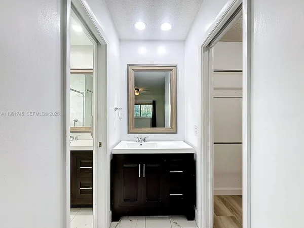 a bathroom with a sink and a mirror