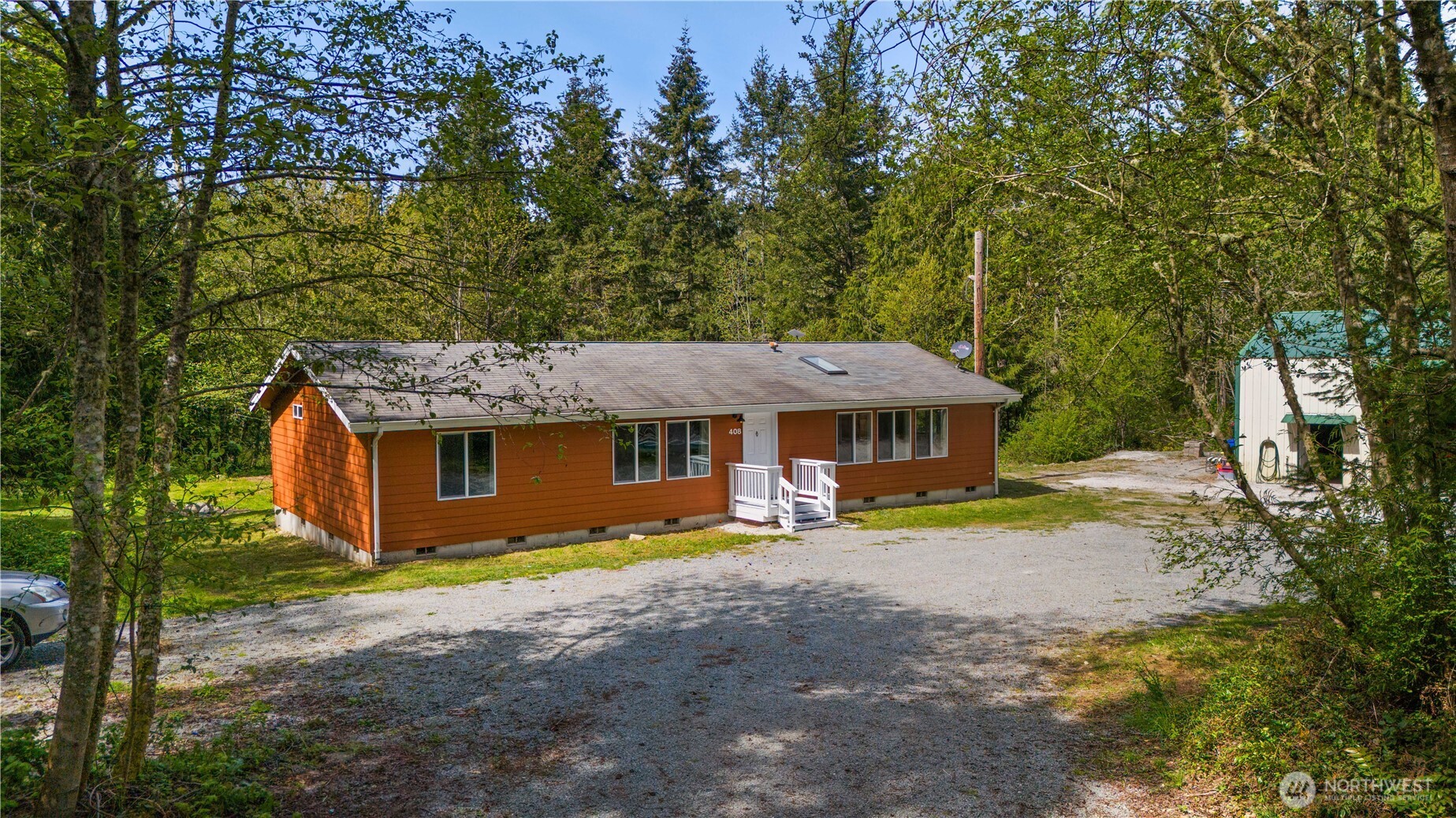a view of a house with pool and a yard