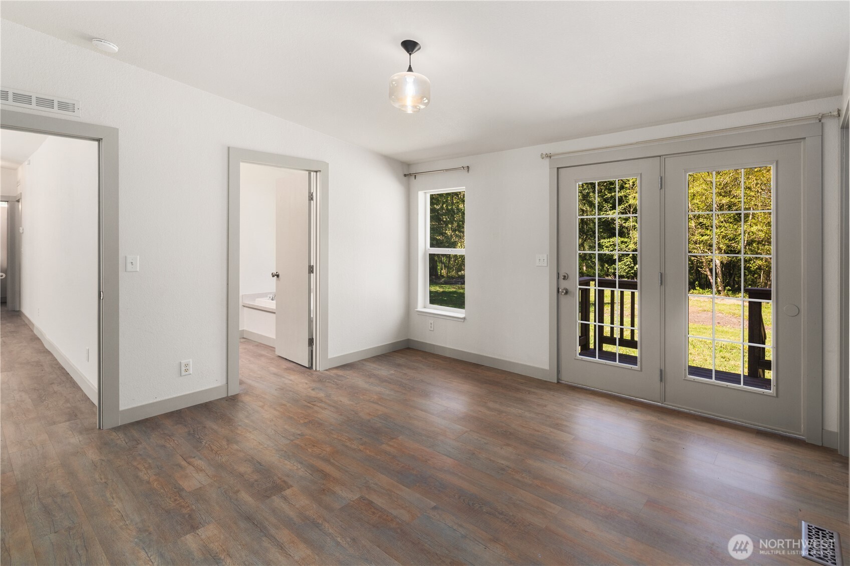 408 South Saylor Road Camano Island, WA 98282 - Photo 13 of 38 a view of an empty room with glass door and balcony