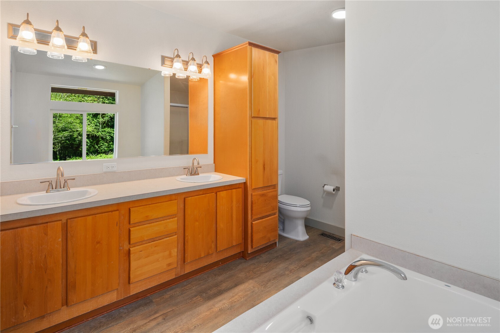 408 South Saylor Road Camano Island, WA 98282 - Photo 16 of 38 a bathroom with a sink and a large mirror