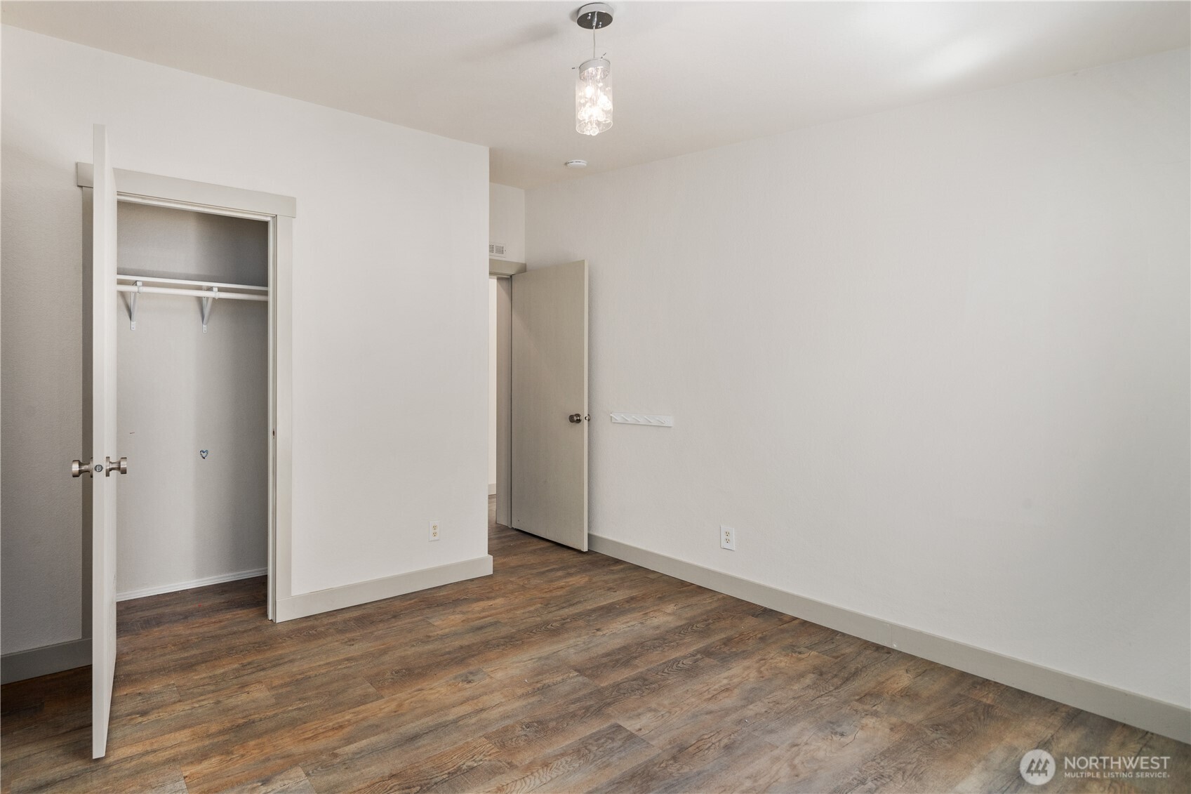 408 South Saylor Road Camano Island, WA 98282 - Photo 23 of 38 an empty room with wooden floor closet and windows
