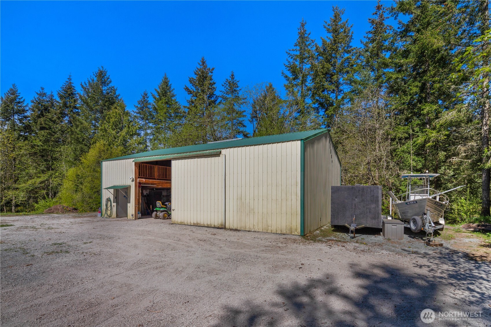 408 South Saylor Road Camano Island, WA 98282 - Photo 24 of 38 a view of a house with a yard and tree