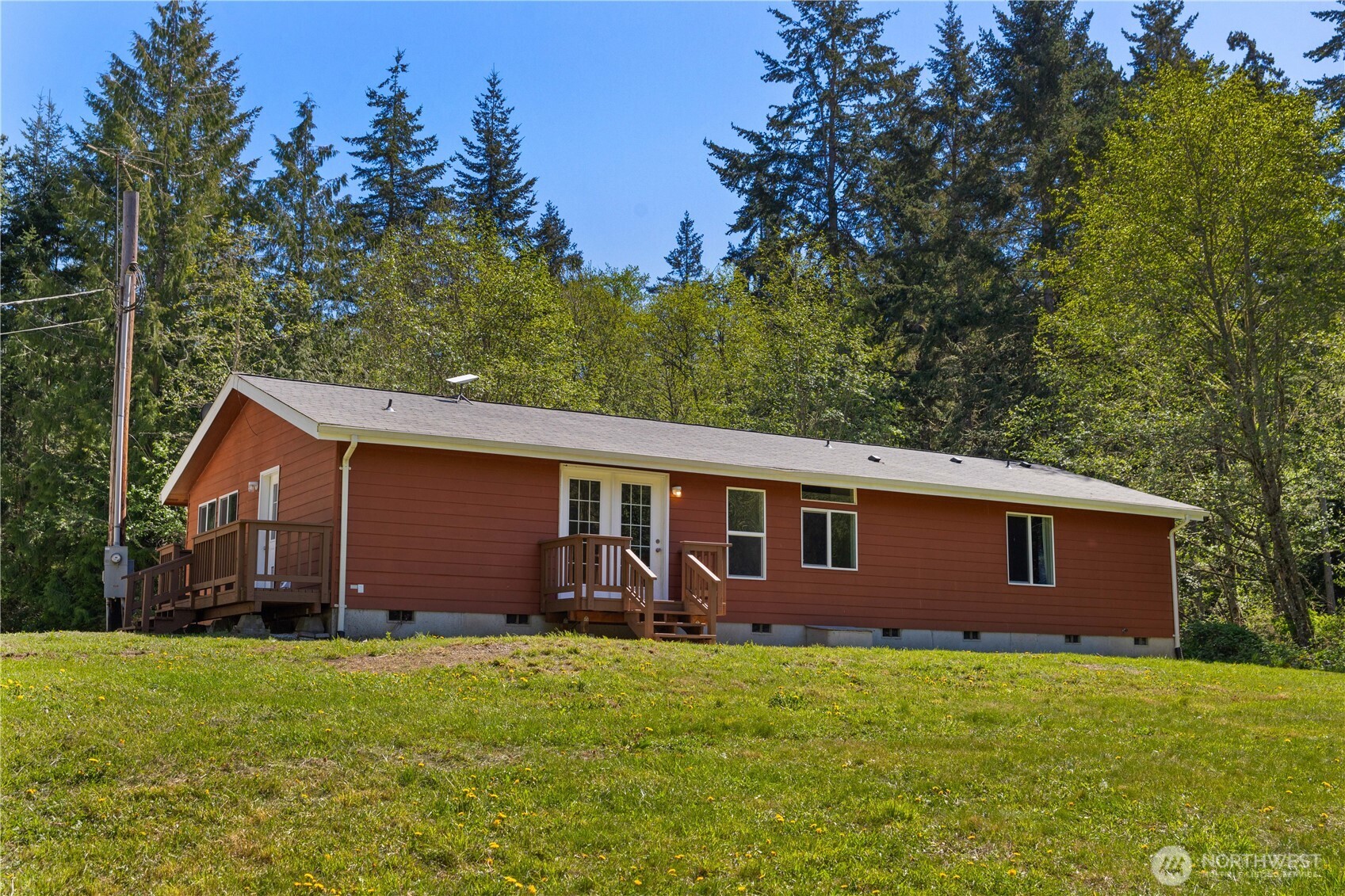 408 South Saylor Road Camano Island, WA 98282 - Photo 3 of 38 a view of a backyard with barn plants and large tree
