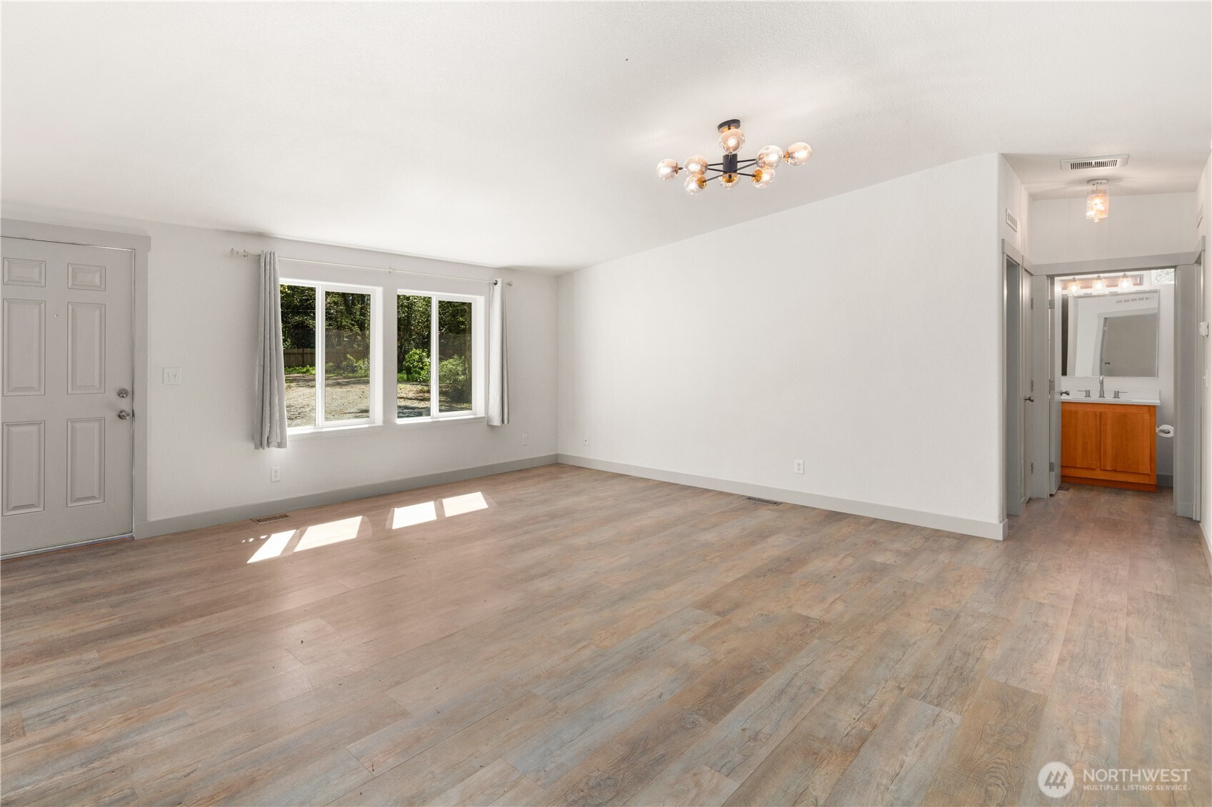 408 South Saylor Road Camano Island, WA 98282 - Photo 4 of 38 a view of an empty room with a window