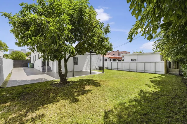 a view of backyard with green space