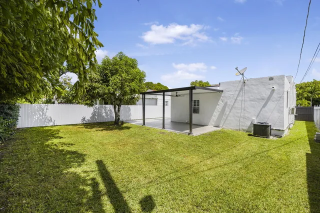 an aerial view of a house with a garden