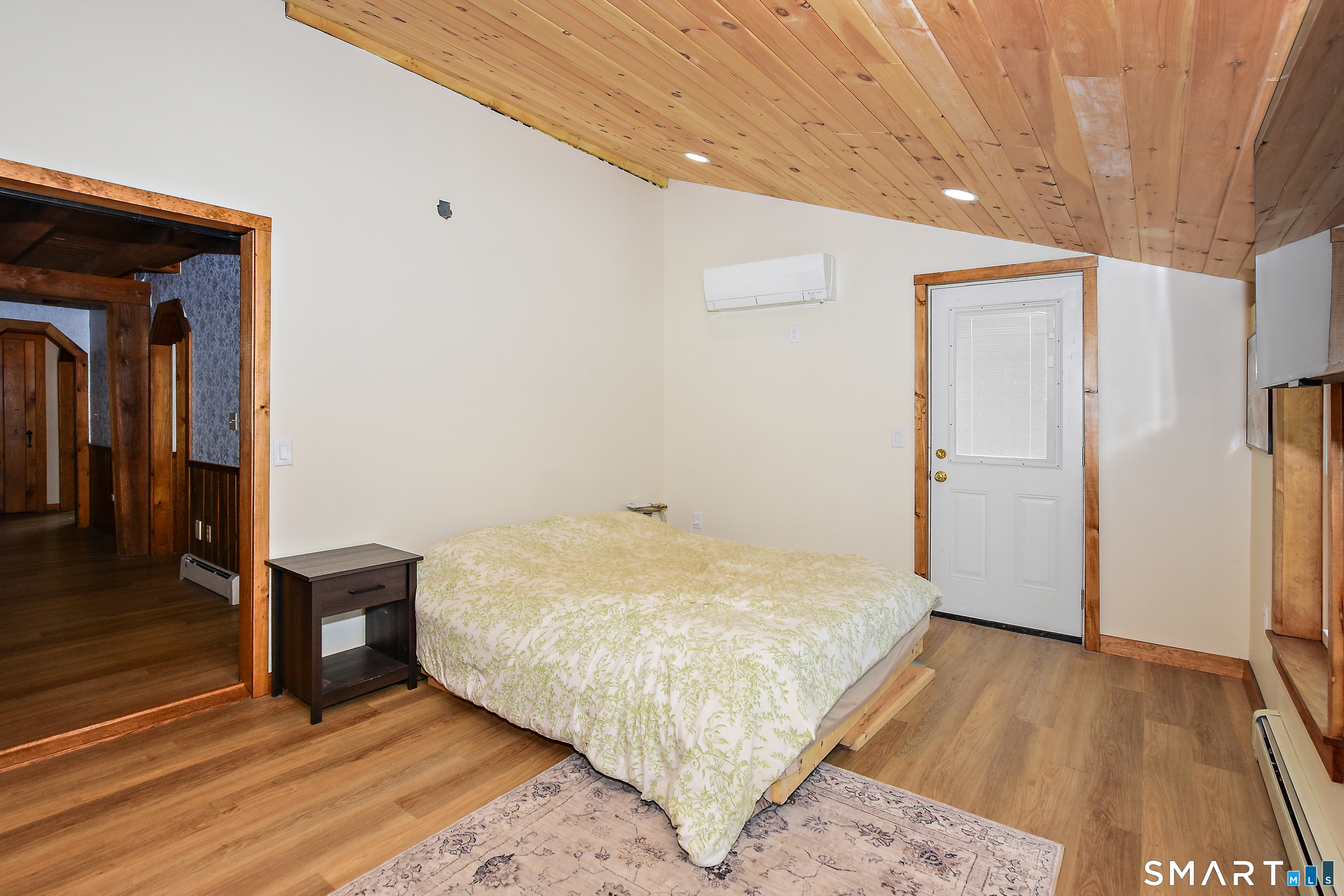 145 Perrin Road Woodstock, CT 06281 - Photo 13 of 33 a bedroom with a bed and wooden floor