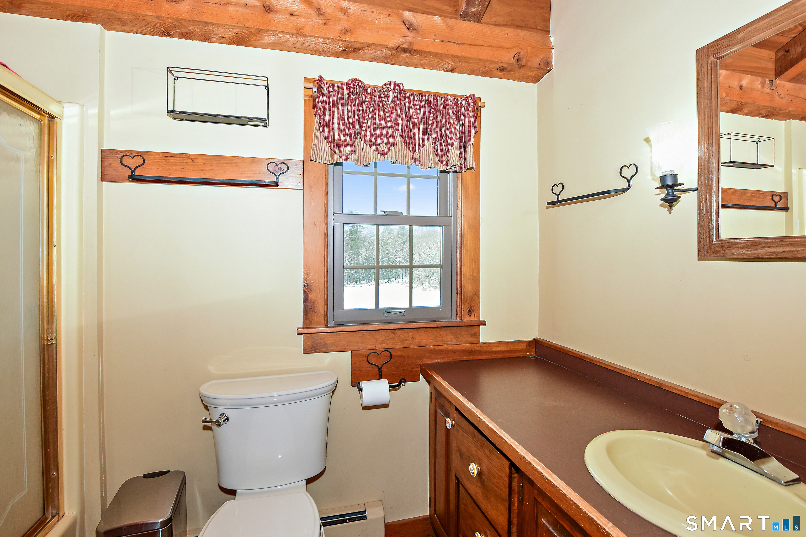 145 Perrin Road Woodstock, CT 06281 - Photo 16 of 33 a bathroom with a sink and a toilet