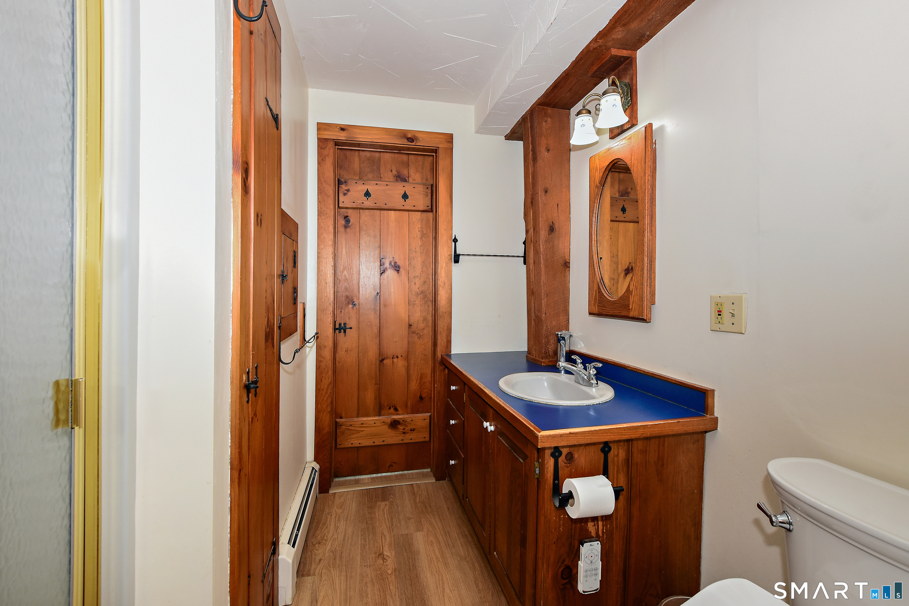 145 Perrin Road Woodstock, CT 06281 - Photo 18 of 33 a bathroom with a granite countertop sink and a mirror