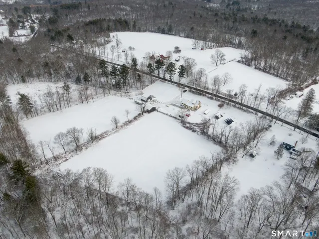 a view of water heater room with stairs
