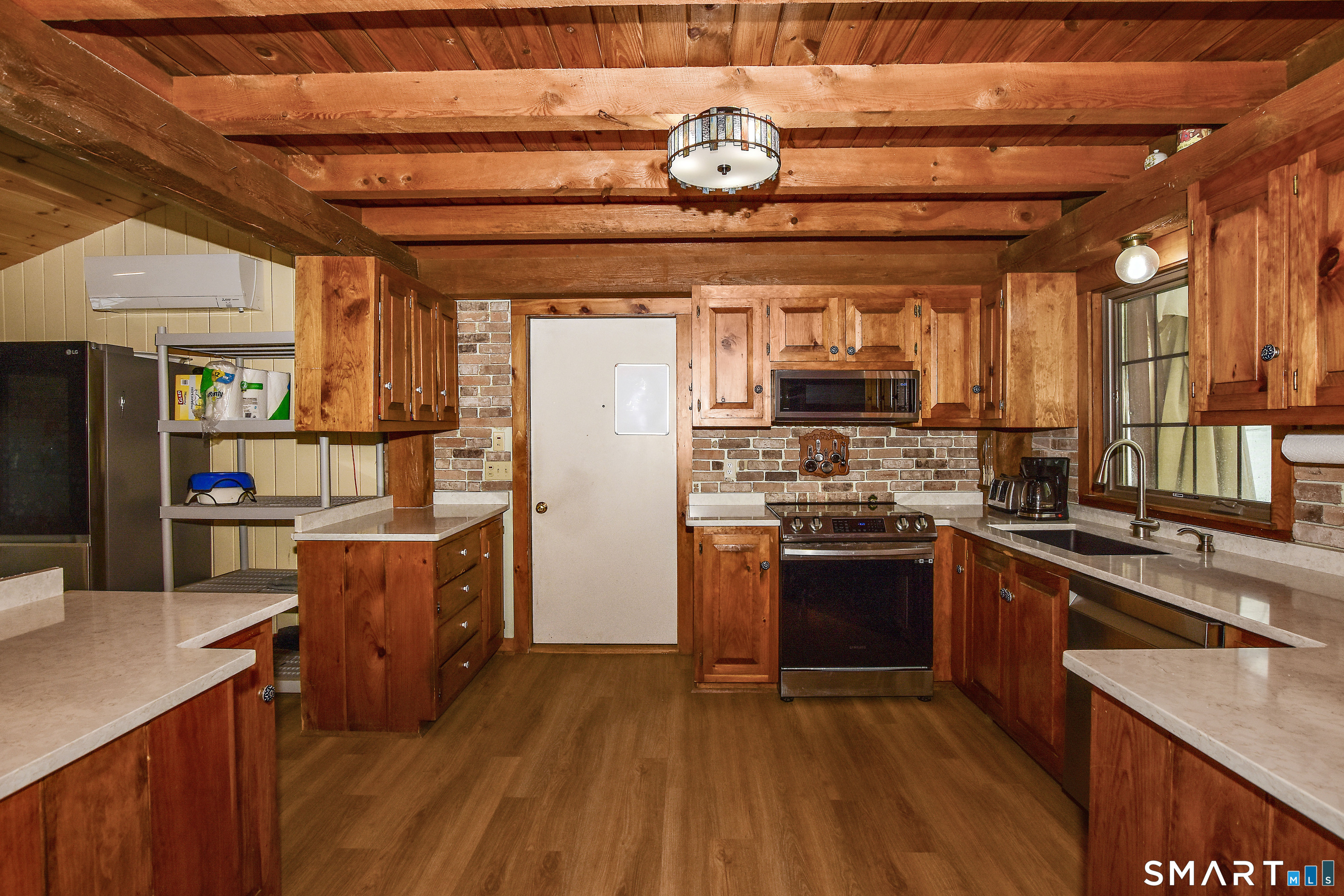 145 Perrin Road Woodstock, CT 06281 - Photo 4 of 33 a kitchen with stainless steel appliances granite countertop a stove and a refrigerator