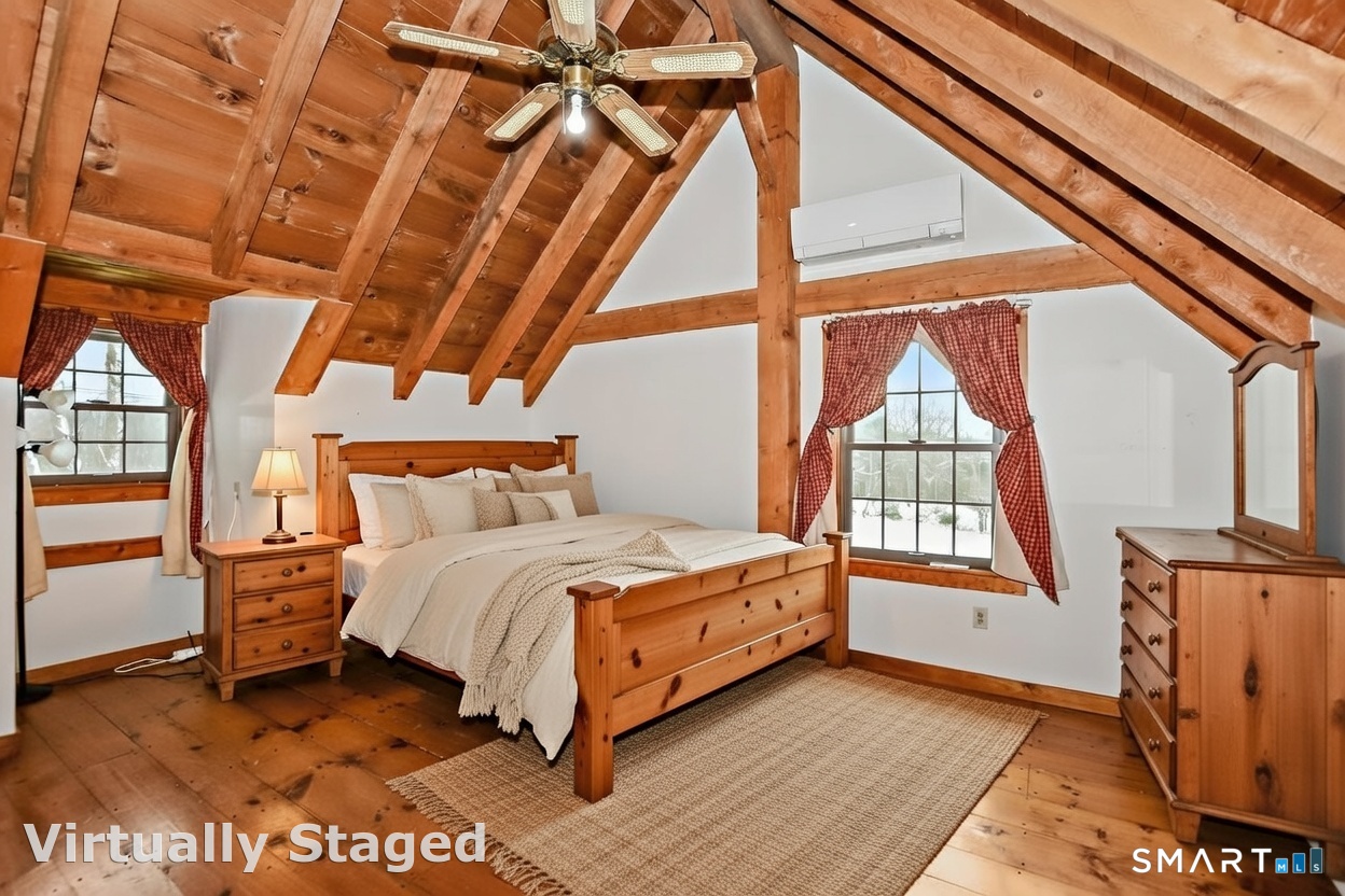 145 Perrin Road Woodstock, CT 06281 - Photo 9 of 33 a bedroom with a bed next to a window