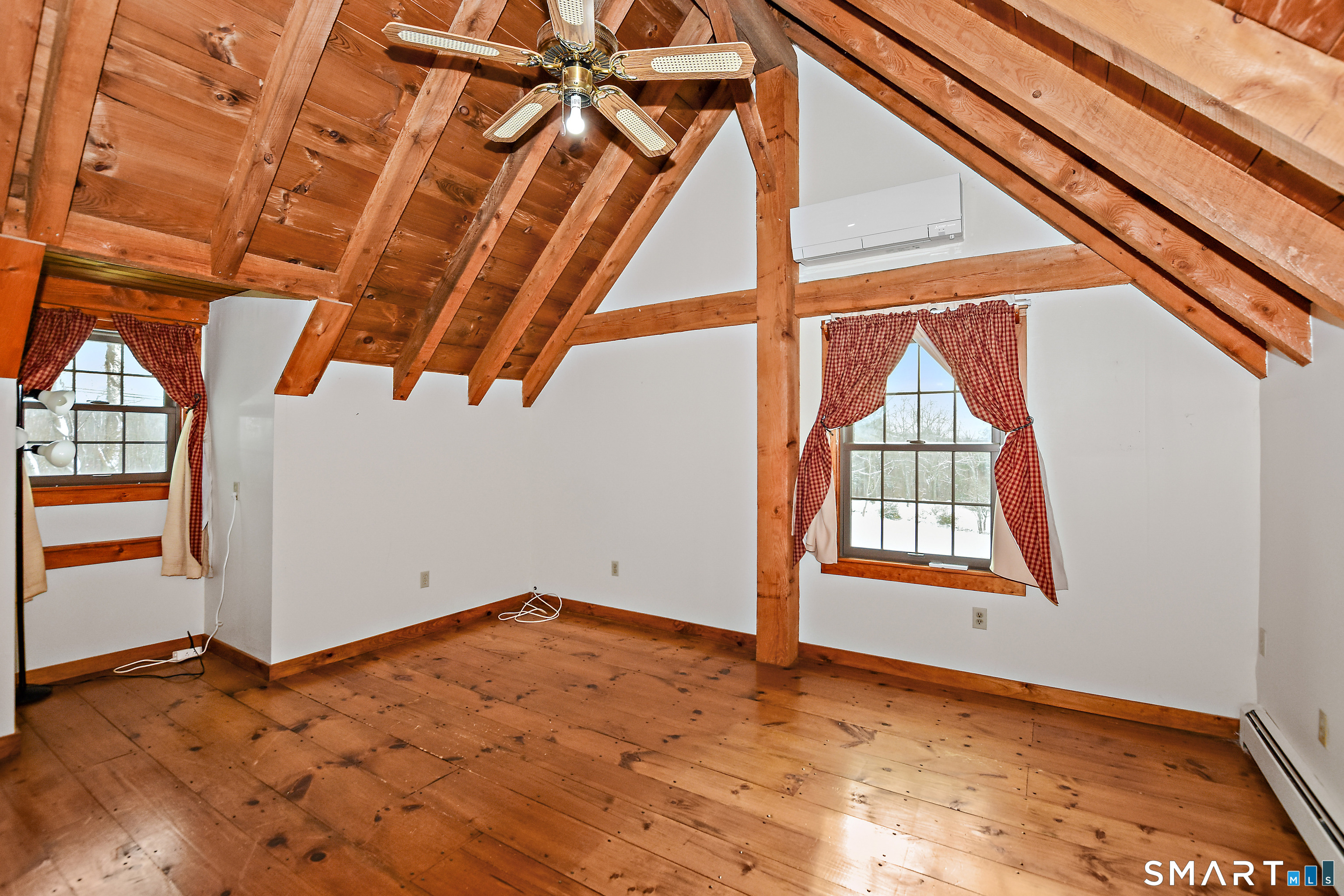 145 Perrin Road Woodstock, CT 06281 - Photo 10 of 33 an empty room with wooden floor and windows
