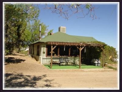 2600 Sunnyslope Road Pinon Hills, CA 92372 - Photo 1 of 1 a front view of a house with a yard and garage
