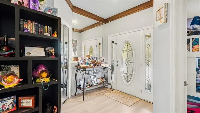 a view of an entryway with wooden floor