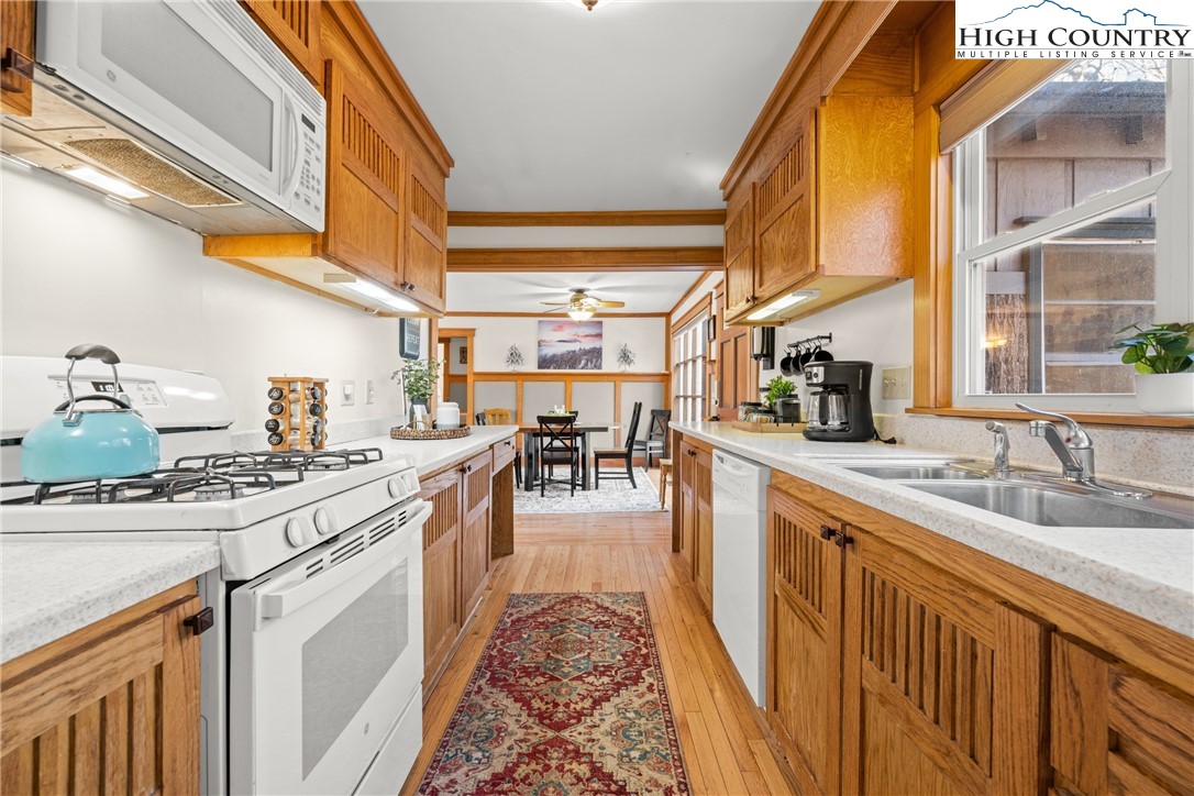 169 Hornbeam Road Beech Mountain, NC 28604 - Photo 13 of 48 a kitchen with a sink and stove
