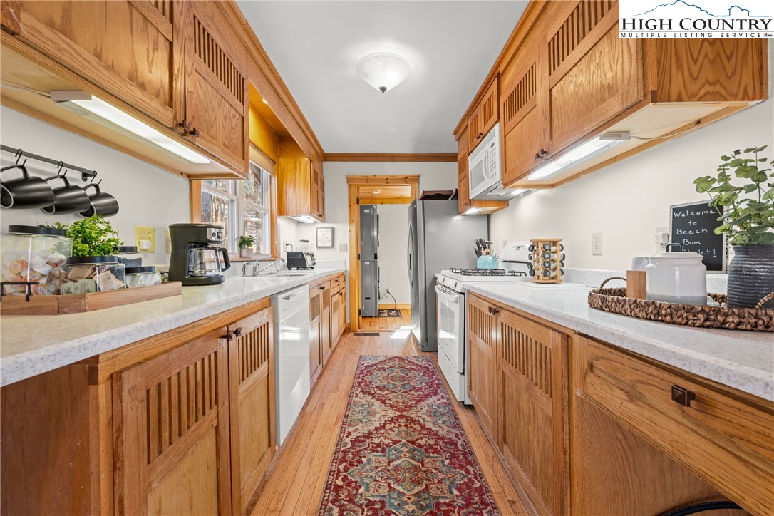 169 Hornbeam Road Beech Mountain, NC 28604 - Photo 15 of 48 a kitchen with stainless steel appliances a sink and cabinets