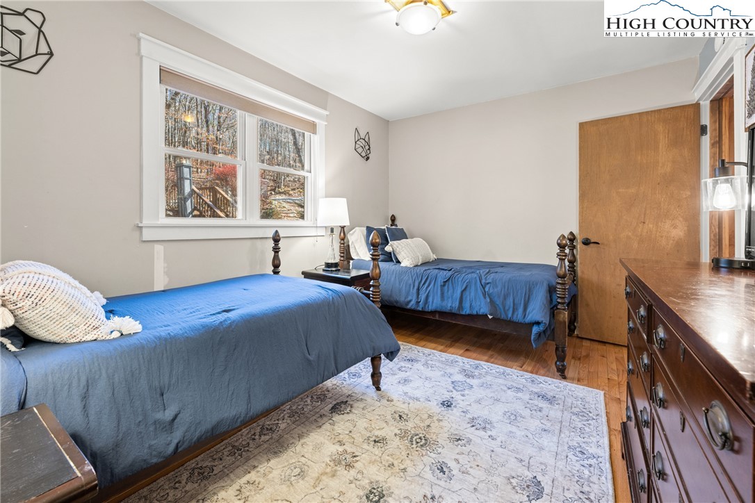 169 Hornbeam Road Beech Mountain, NC 28604 - Photo 25 of 48 a bedroom with two beds and a large window