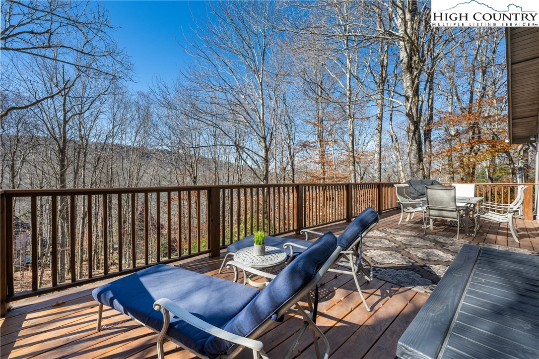 169 Hornbeam Road Beech Mountain, NC 28604 - Photo 26 of 48 a view of a patio with two chairs and a table