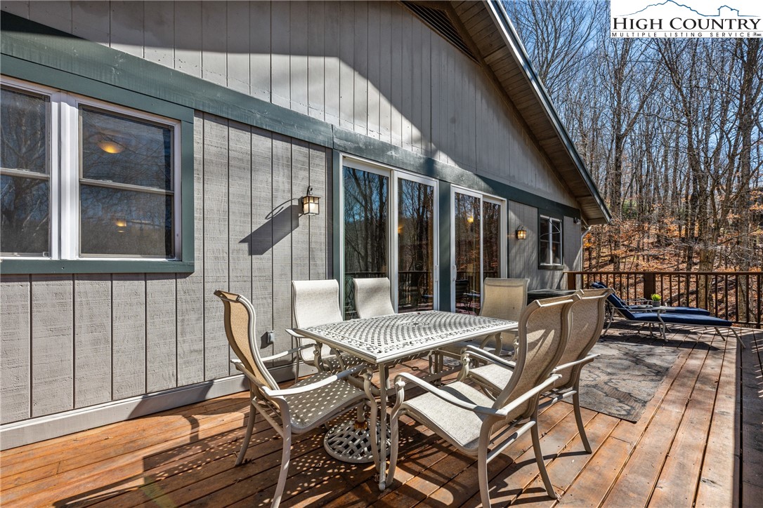 169 Hornbeam Road Beech Mountain, NC 28604 - Photo 28 of 48 a view of a patio with table and chairs