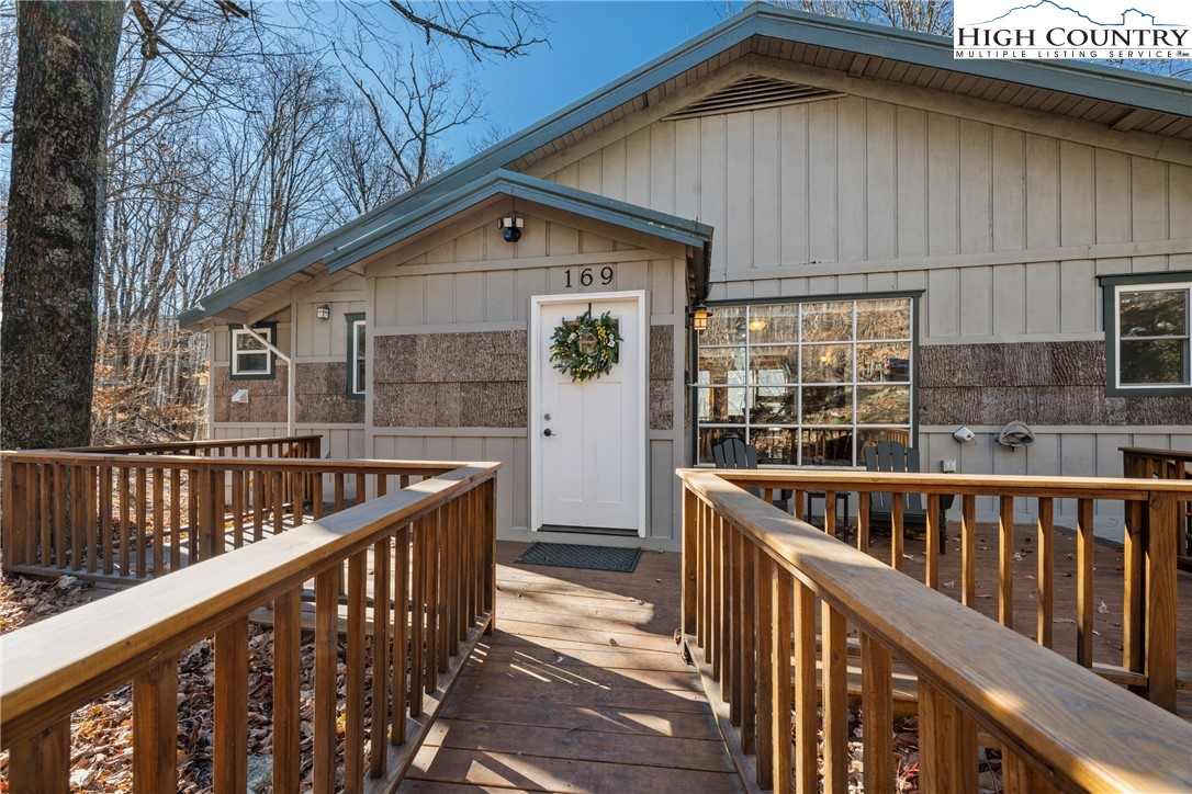169 Hornbeam Road Beech Mountain, NC 28604 - Photo 3 of 48 a view of house with wooden deck and furniture