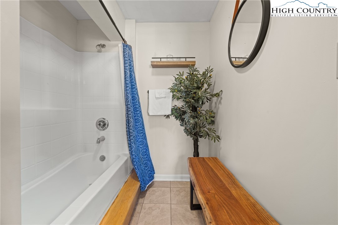 169 Hornbeam Road Beech Mountain, NC 28604 - Photo 37 of 48 a bathroom with a tub and shower