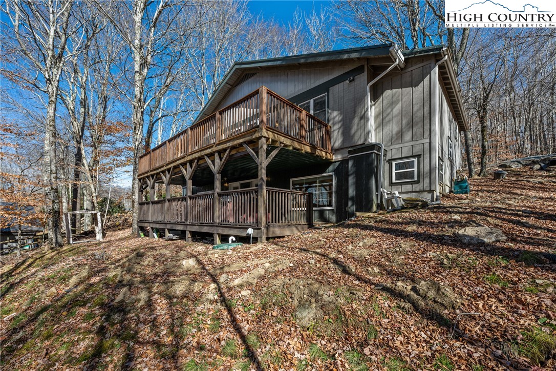 169 Hornbeam Road Beech Mountain, NC 28604 - Photo 40 of 48 a view of a house with a yard