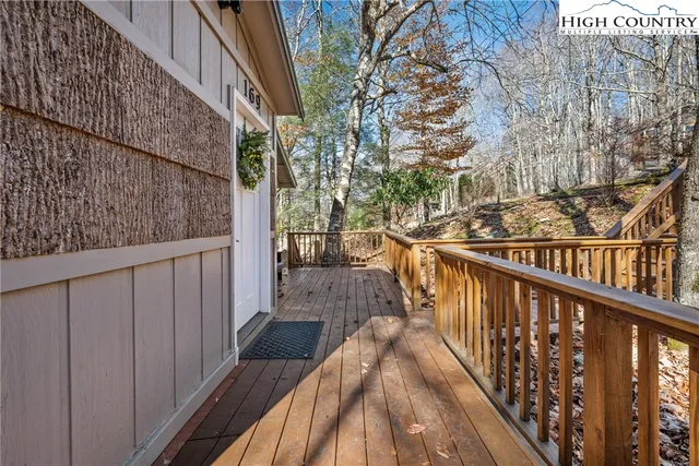 a view of balcony with wooden floor