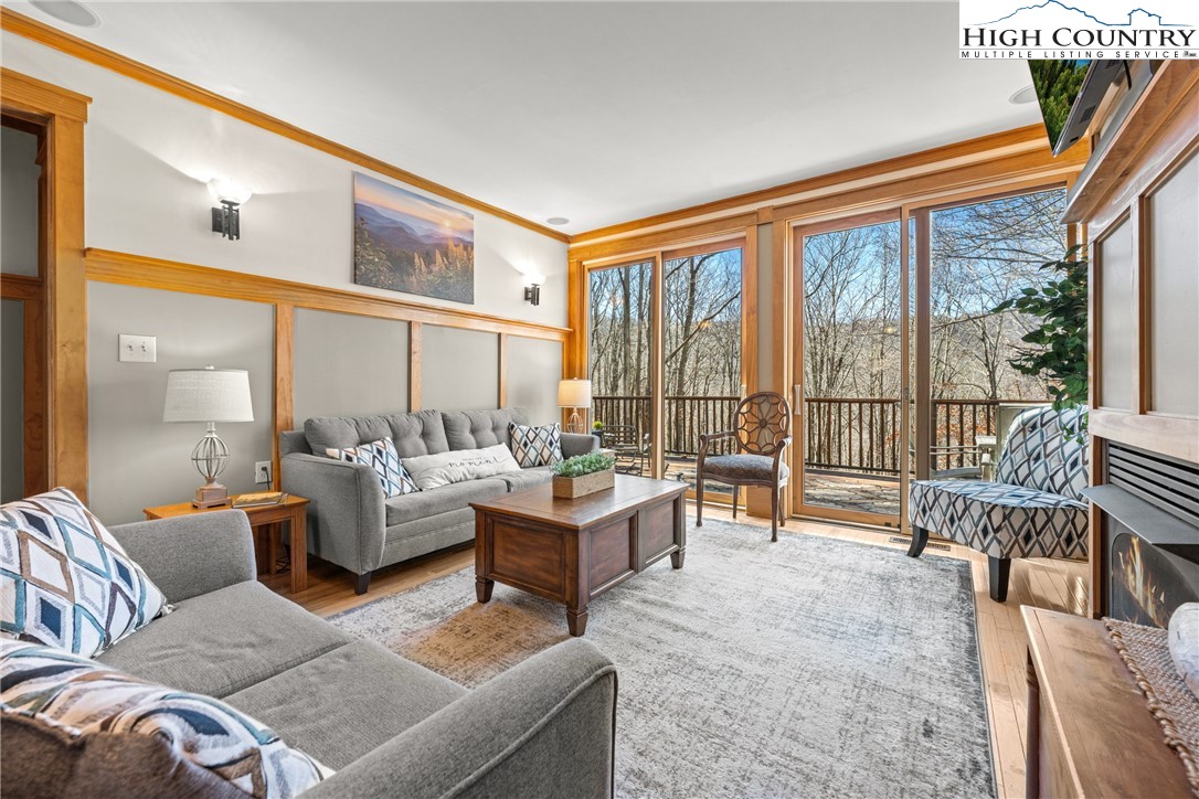 169 Hornbeam Road Beech Mountain, NC 28604 - Photo 5 of 48 a living room with furniture and a large window