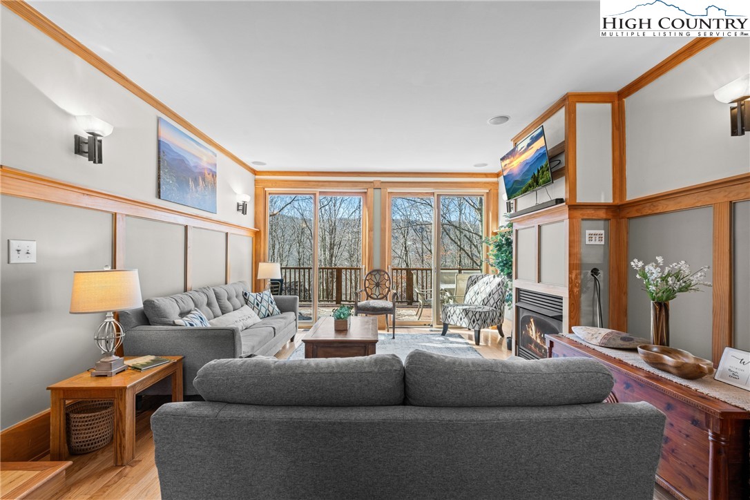 169 Hornbeam Road Beech Mountain, NC 28604 - Photo 6 of 48 a living room with furniture and a large window