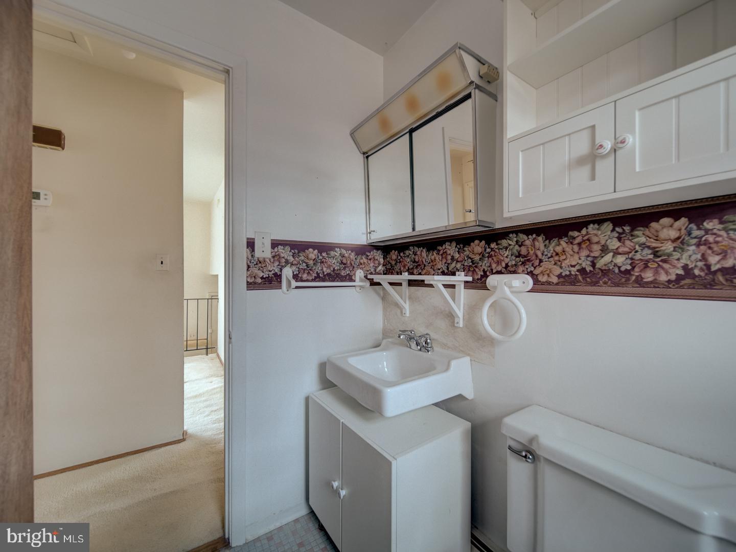 15140 Georgia Road Woodbridge, VA 22191 - Photo 19 of 37 a bathroom with a sink and a vanity