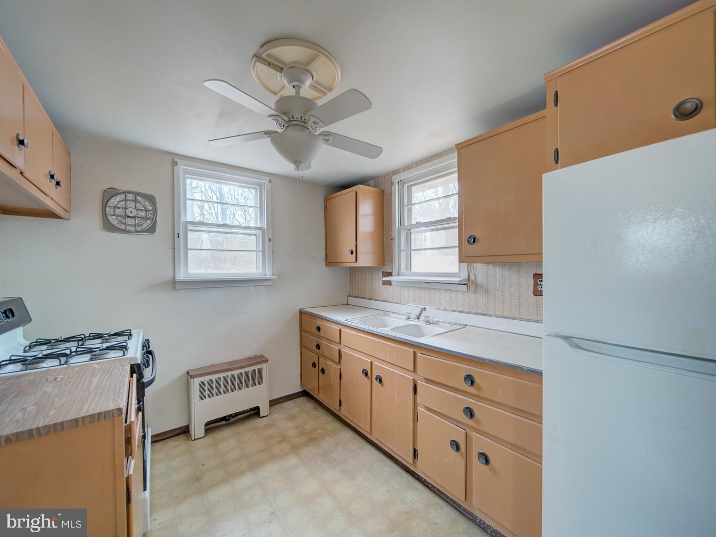 15140 Georgia Road Woodbridge, VA 22191 - Photo 29 of 37 a bathroom with a granite countertop sink a mirror and a shower