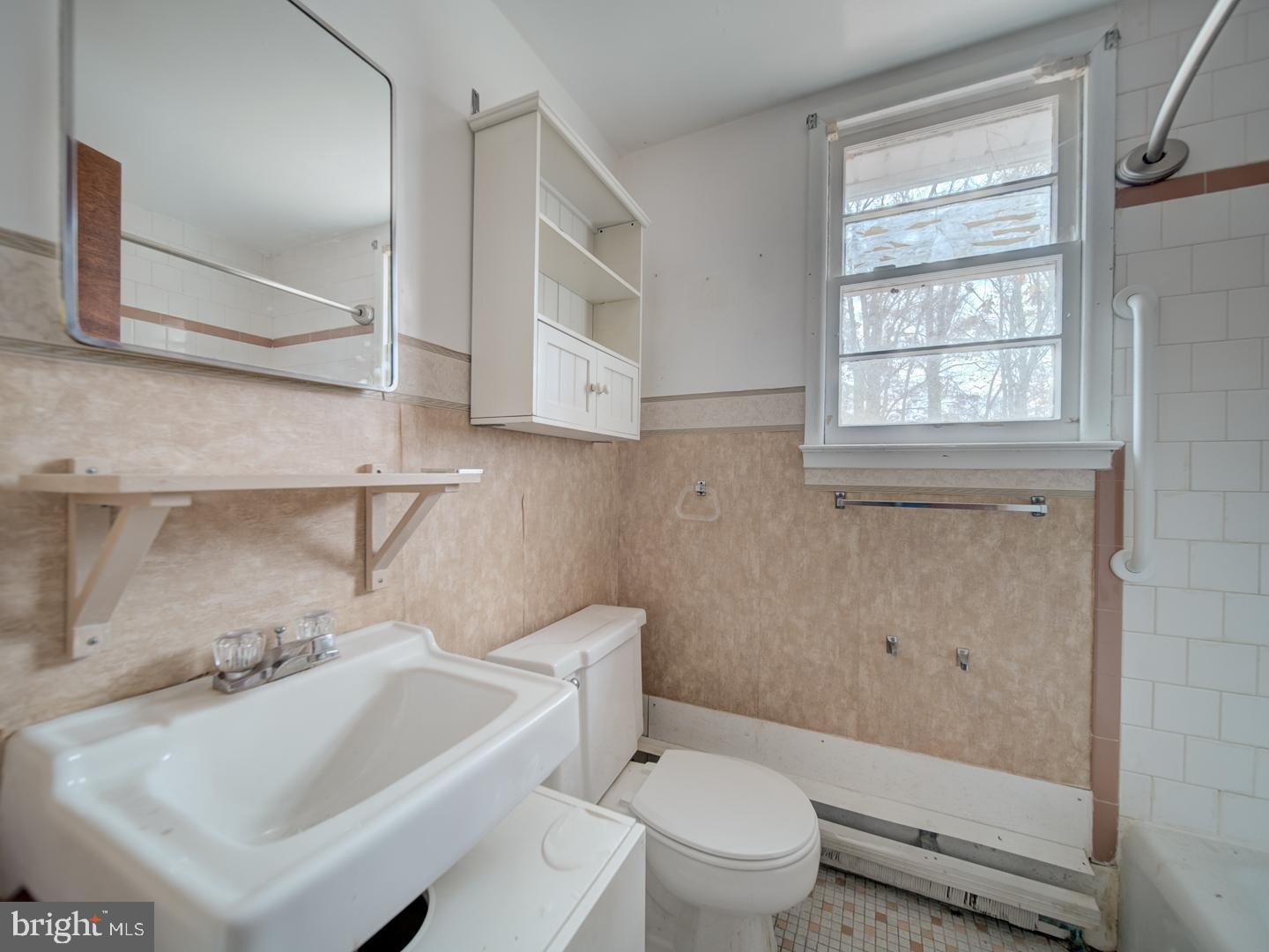 15140 Georgia Road Woodbridge, VA 22191 - Photo 36 of 37 a white toilet sitting next to a bathroom sink