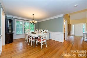 2430 Willowbrook Drive Matthews, NC 28104 - Photo 5 of 10 a dining room with furniture window and wooden floor