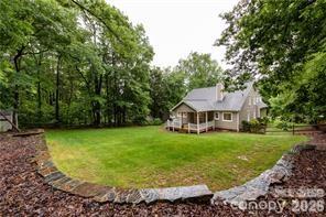 2430 Willowbrook Drive Matthews, NC 28104 - Photo 9 of 10 a view of a house with a backyard porch and sitting area
