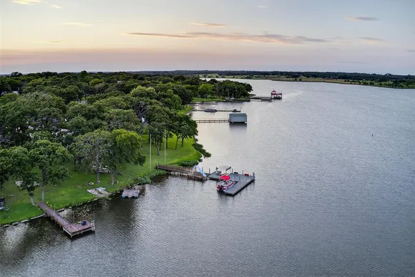 a view of a lake with houses in the back