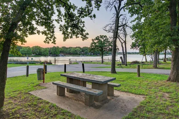 a view of a park with large trees
